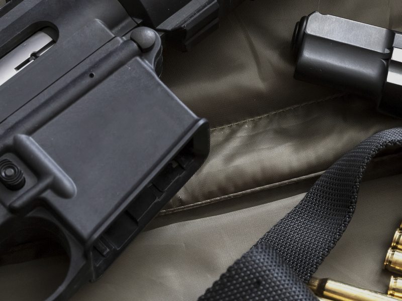 Rifle and pistol laid out for firearms recertification training